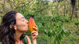 Leonie kisses cacao pod